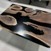 Black epoxy river coffee table matching live edge dining set