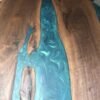 Black walnut teal epoxy dining table grain detail close up
