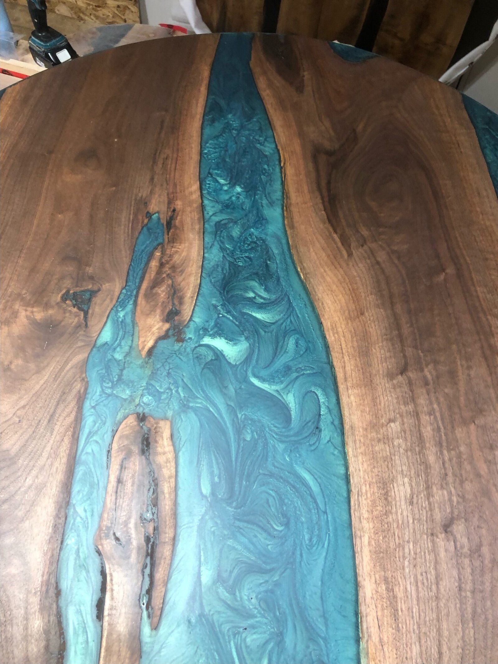 black-walnut-teal-epoxy-table-grain-detail Black walnut teal epoxy dining table grain detail close up