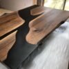 Custom live edge black walnut coffee table with black epoxy river handcrafted in Canada