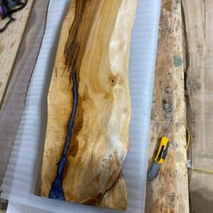 Maple live edge console table calcite blue epoxy highlights angled view