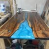 Black walnut clear top epoxy river dining table front view