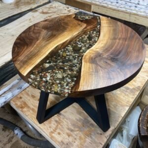 Round black walnut clear epoxy river coffee table with natural rock feature handcrafted in Canada
