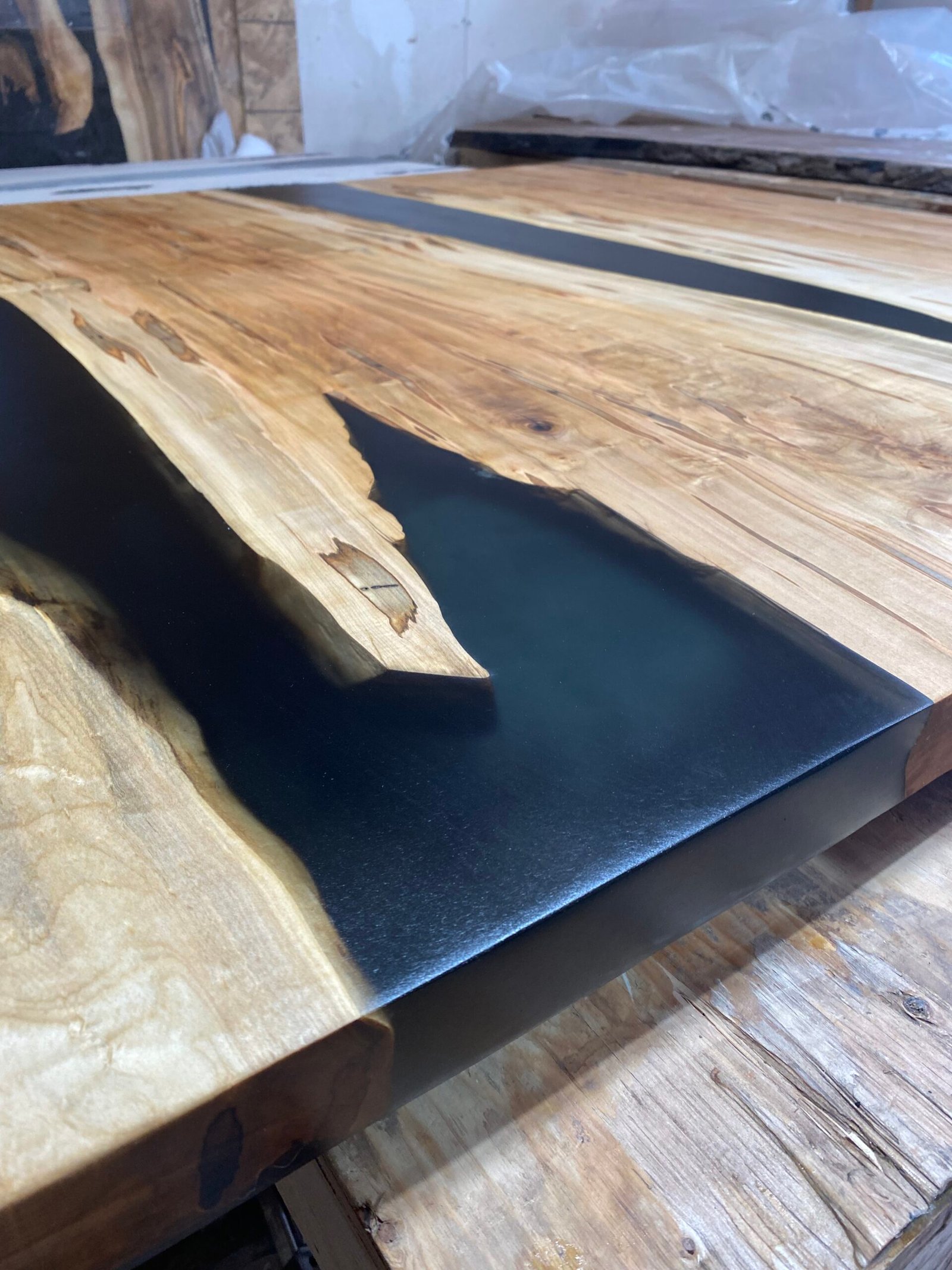 5ft-ambrosia-maple-epoxy-coffee-table-angled-view 5ft ambrosia maple black epoxy river coffee table angled view