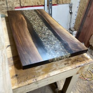 Black walnut clear epoxy river desk natural rock inserts top view