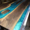 Live edge walnut boardroom table with turquoise epoxy river and islands