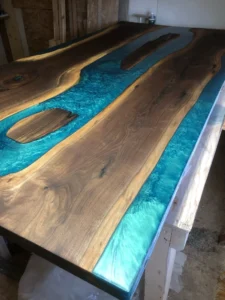 Live edge walnut boardroom table with turquoise epoxy river and islands
